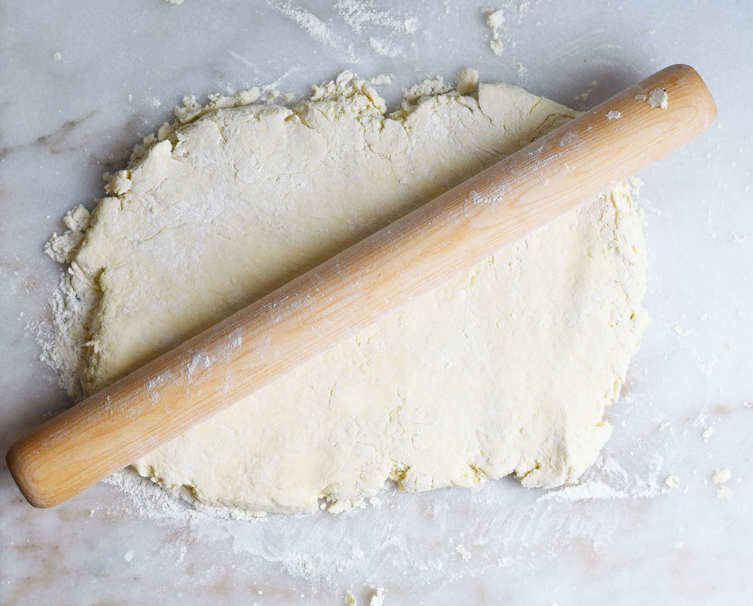 biscuit dough rolled out into a sheet