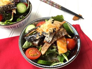 Mixed Baby Greens with Grilled Salmon Skin and Citrus Soy Dressing