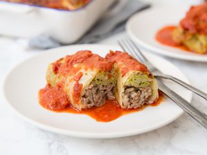 Stuffed cabbage rolls with ground beef and rice on a plate