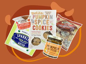 Cutouts of Trader Joe's pumpkin spice cookies, pumpkin butter, maple flavored marshmallows, apple cinnamon yogurt, and green apple sparkling water on a burnt orange background