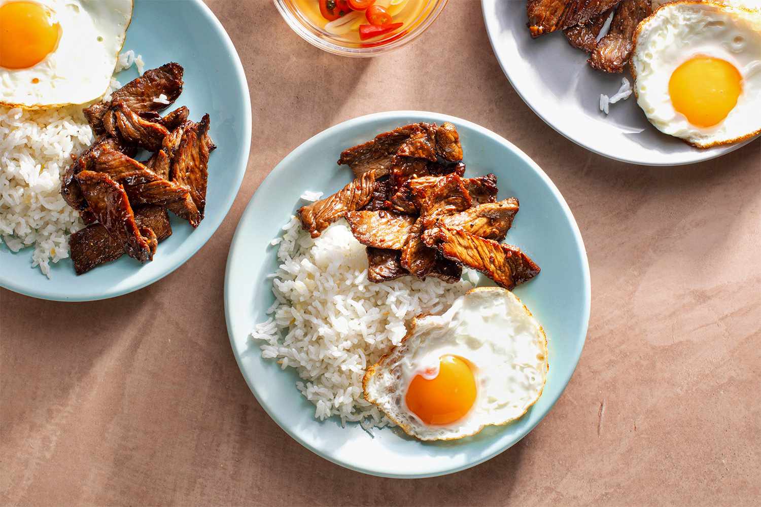 Tapsilog on plates 