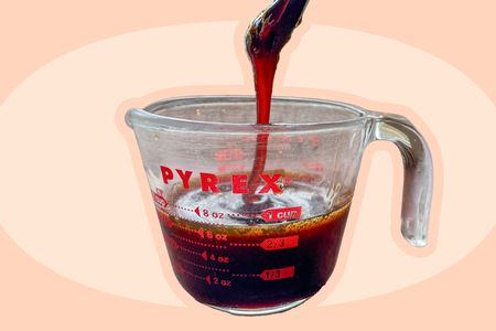 Cider syrup in a glass Pyrex measuring cup