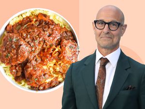 Stanley Tucci next to a dish of chicken cacciatore