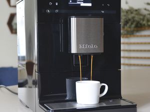 Closeup of the Miele CM5300 Countertop Coffee System dispensing coffee into a mug