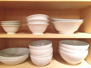 Close up of dinnerware in cabinet