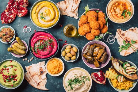 Mezze spread with pita bread, dolmas, hummus, baba ghanoush, and more