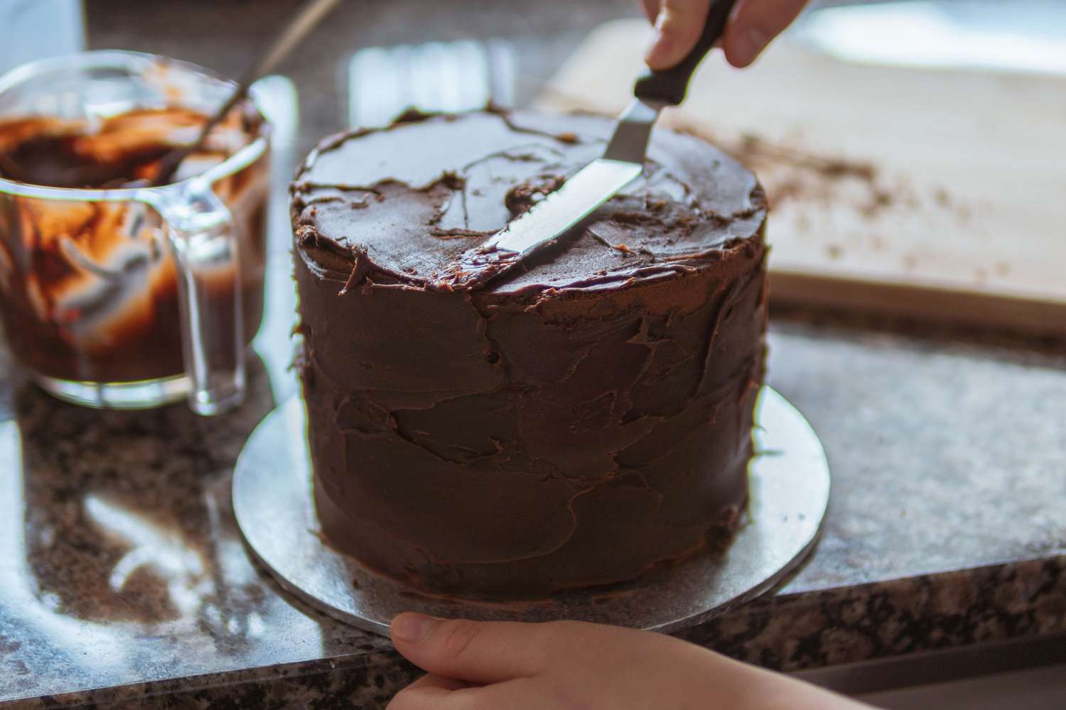 Icing a cake with an offset spatula