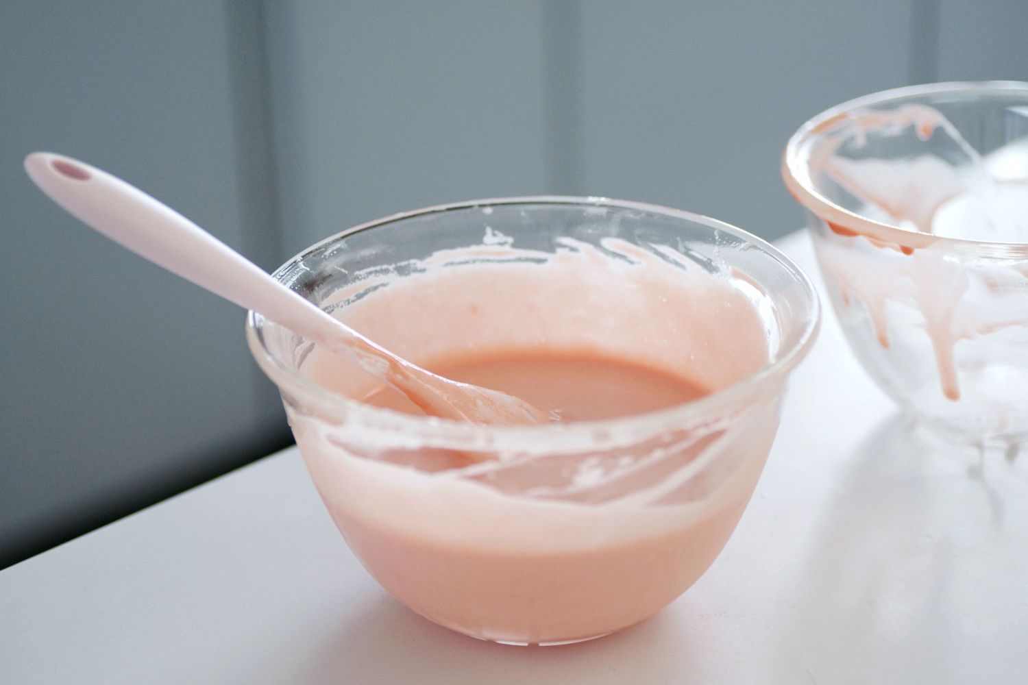 Glass mixing bowls with pink frosting