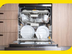 A photo of an open dishwasher filled with clean dishes