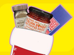 An illustrated red stocking with three Trader Joe's products sticking out the top