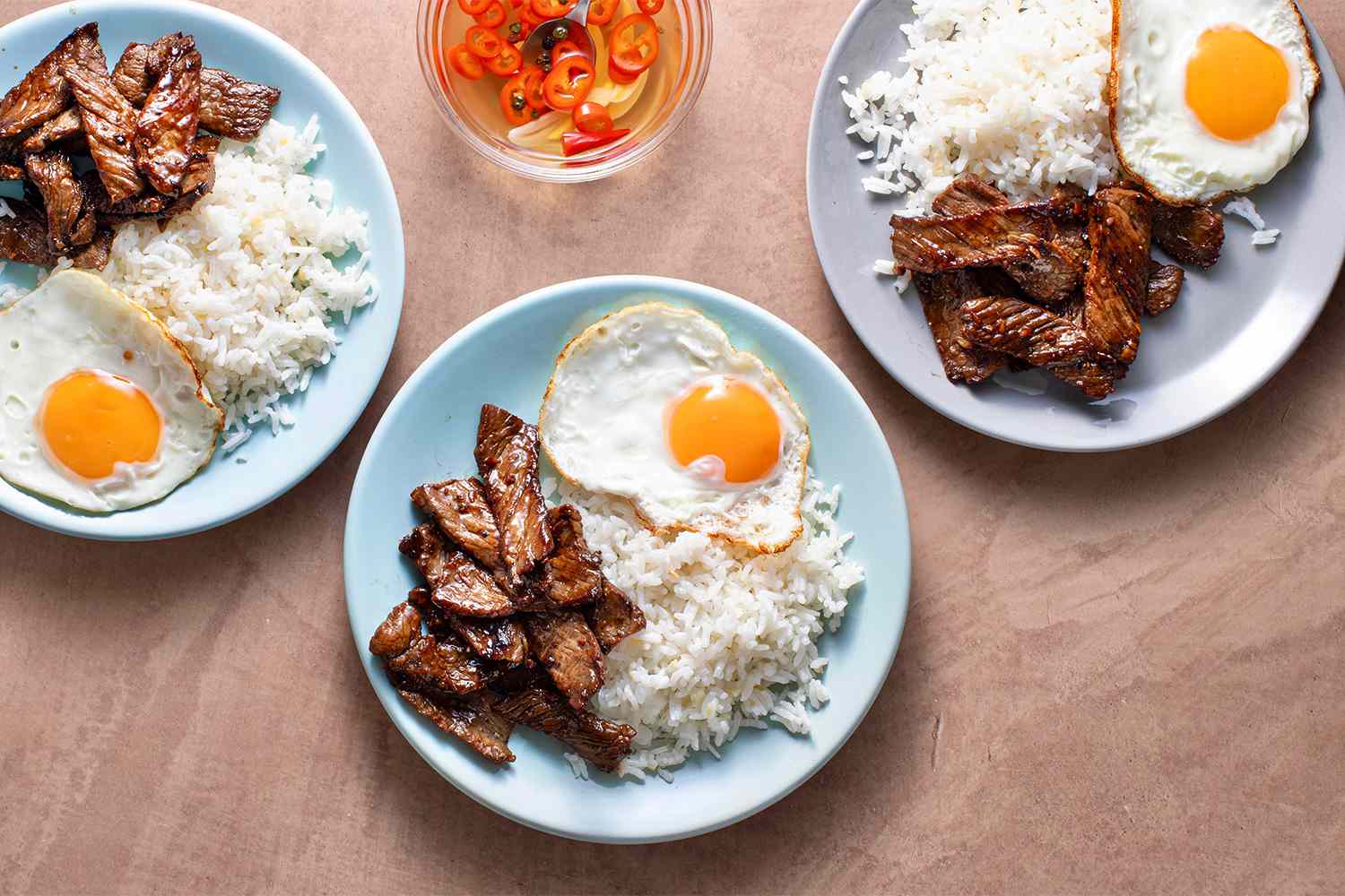 Tapsilog on plates 