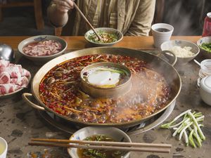 Person eating hot pot in Sichuan, Chin