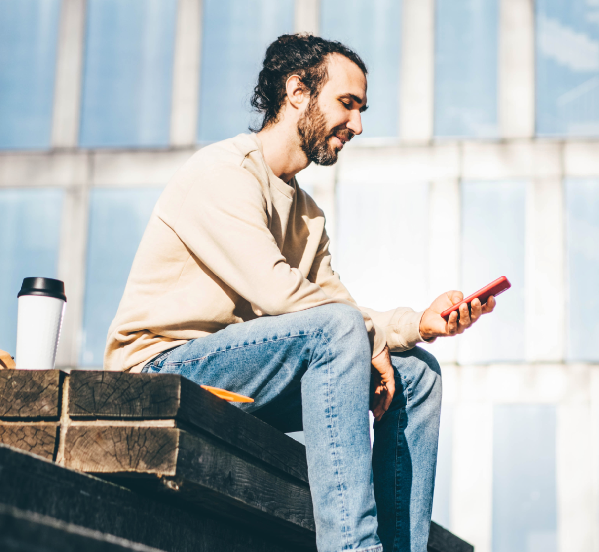 man sitting and texting