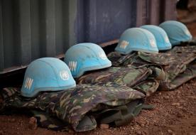 blue helmets and uniforms on the ground