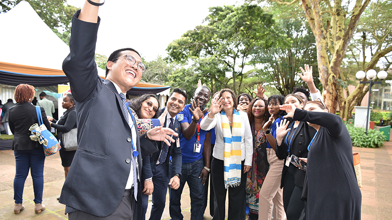 Participants of the Conference take a selfie with USG Melissa Fleming 