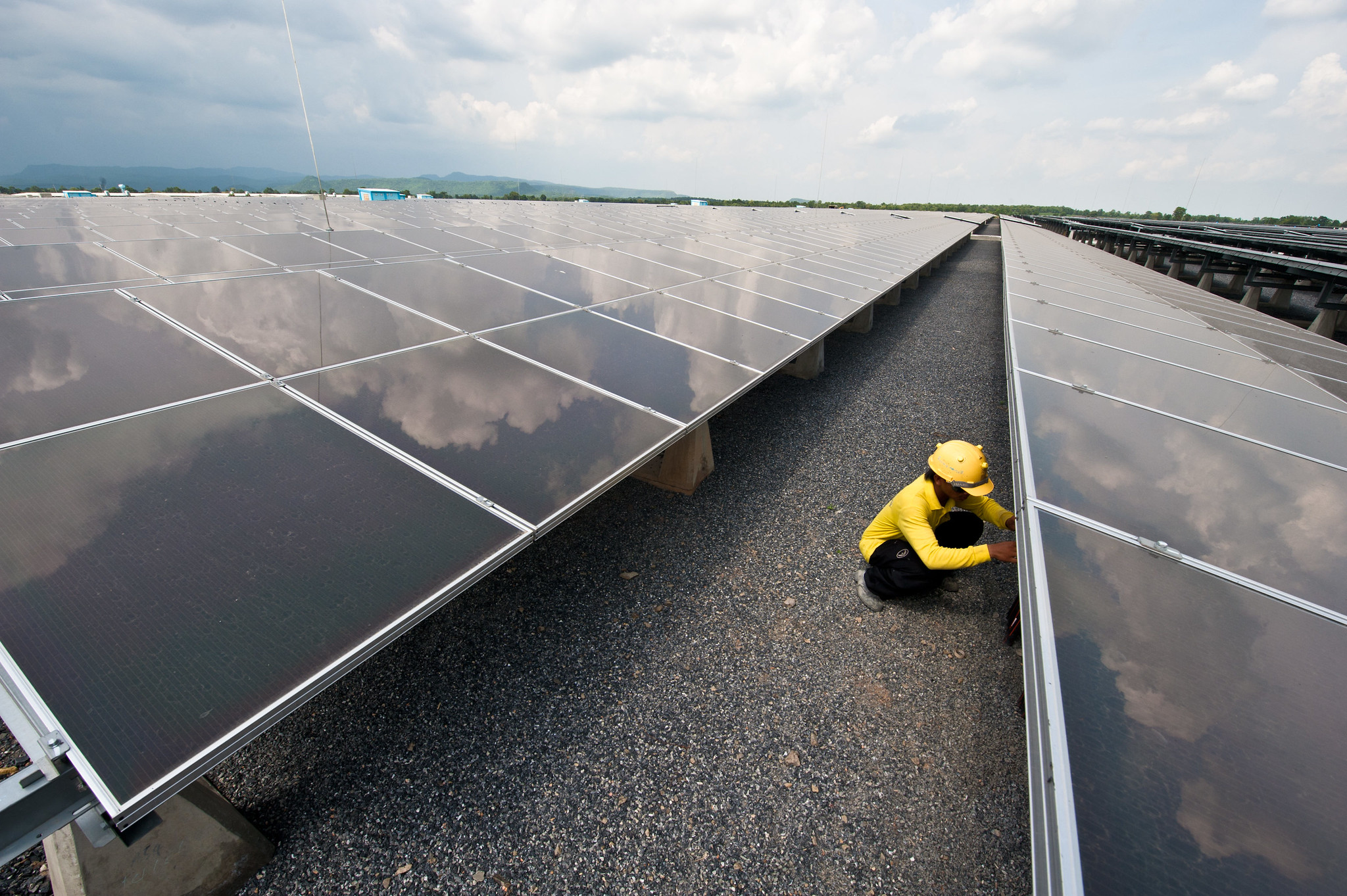 Technicians working on solar panels.