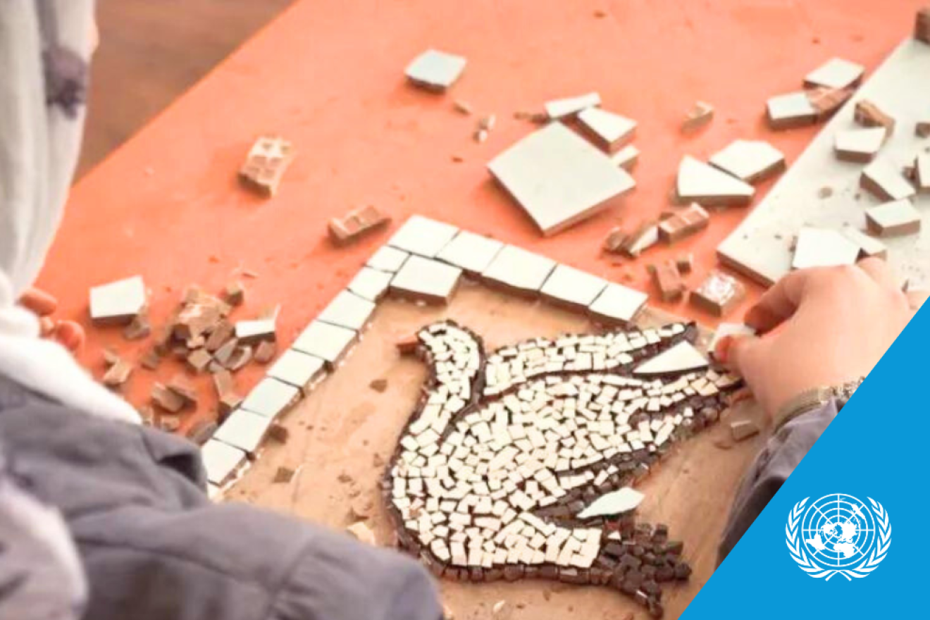 woman making peace dove mosaic