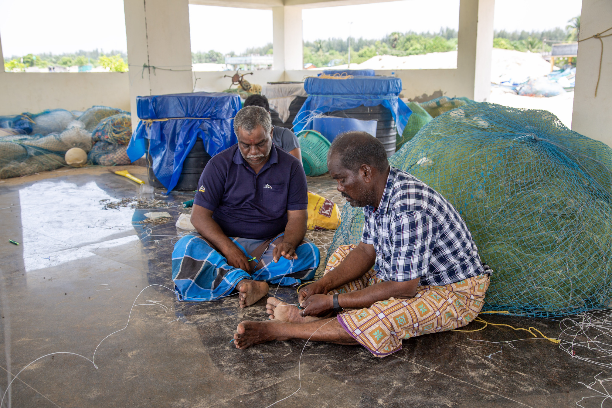 Fisherfolk preparing nets