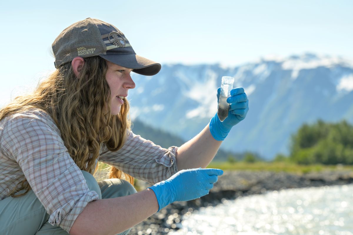 Memphis Hill, Ph.D., collecting samples from Grewingk Creek