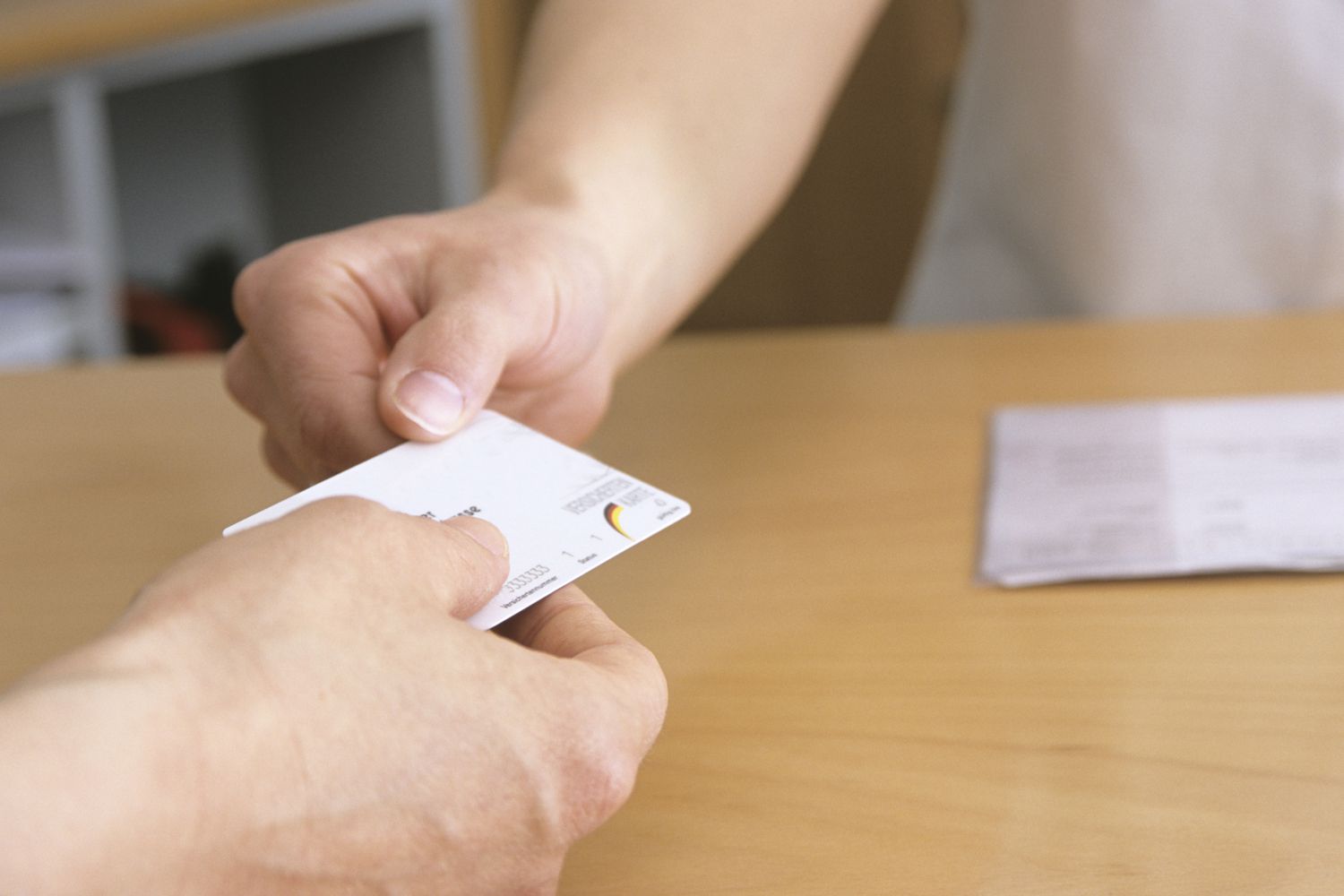 A patient presents a health insurance card