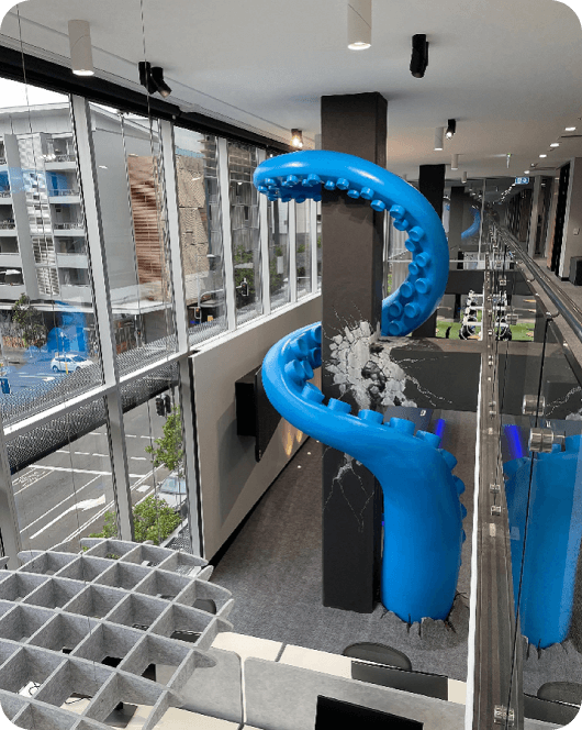 Office with large blue tentacle coming out of the floor and surrounding a pillar