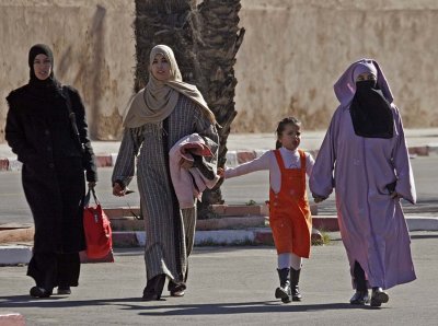 Local people - dress varies from traditional to western