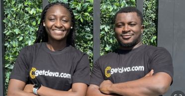 Cleva founders Tolu Alabi, left, and Philip Adama Abel ’15 stand side by side with arms folded wearing company T-shirts.