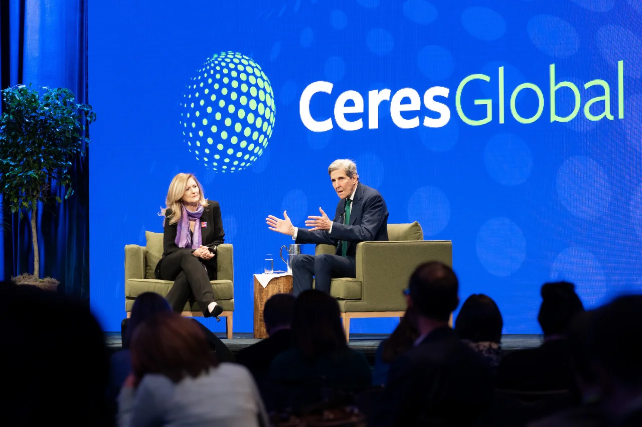 Anne Kelly and John Kerry on stage at Ceres Global