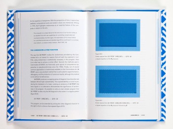 A book open to a page with text and blue patterned images.