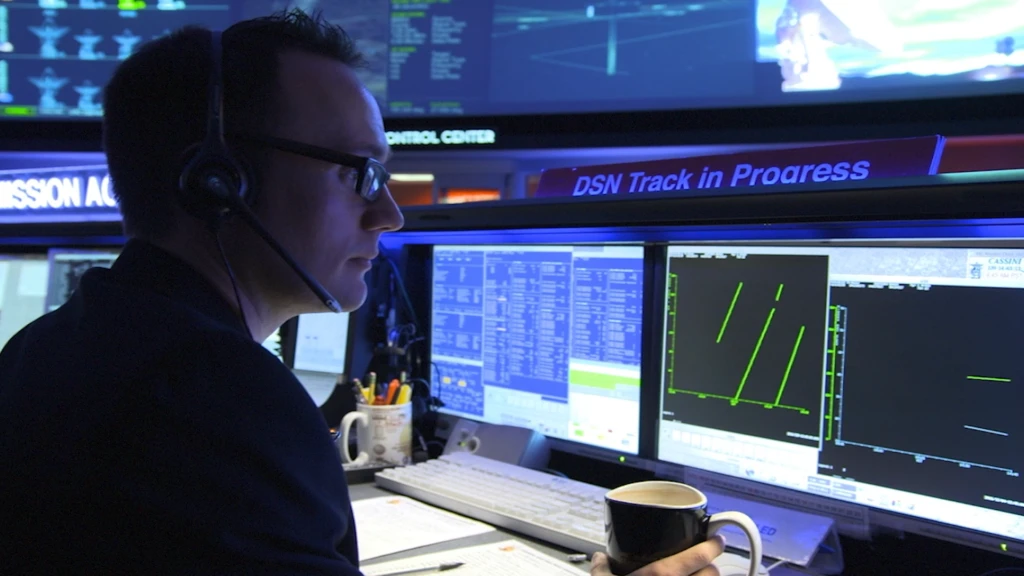 a man standing in front of a computer screen