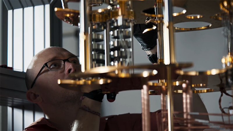 Man looking at quantum machine