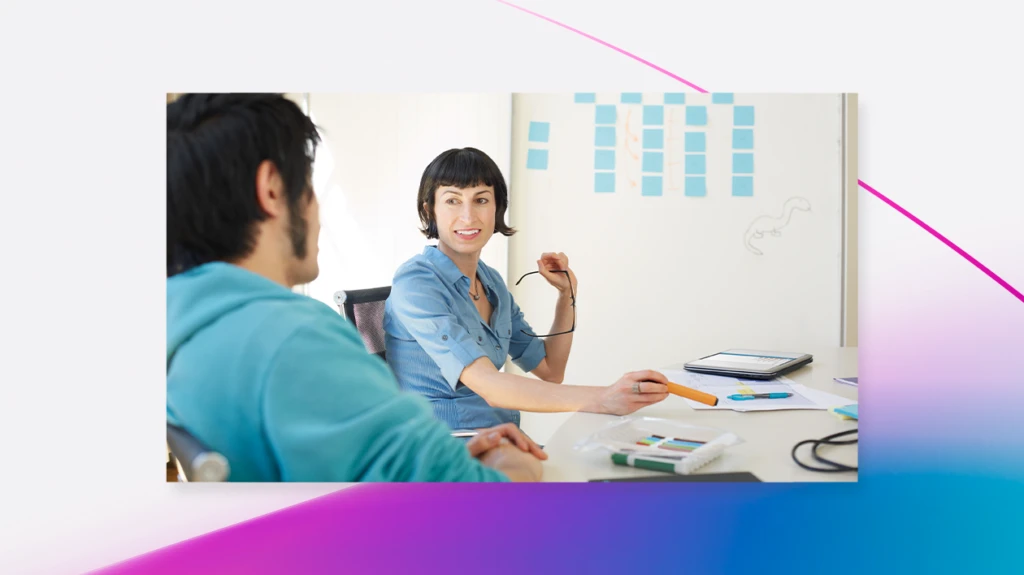 Developers meeting in front of a whiteboard