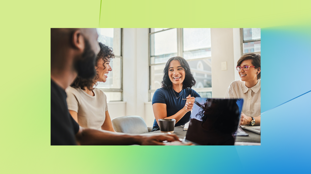 A group of colleagues on their computers, overlaid on a colorful yellow, green and blue gradient background.