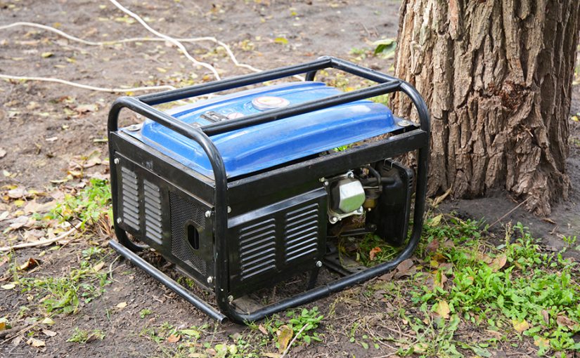 A portable generator placed outside and in a dry area on the ground.