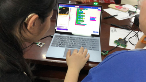 woman studying on laptop