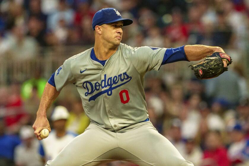 Los Angeles Dodgers pitcher Jack Flaherty throws in in the first inning of a baseball game.