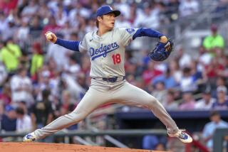 Los Angeles Dodgers pitcher Yoshinobu Yamamoto throws in the first inning of a baseball game.