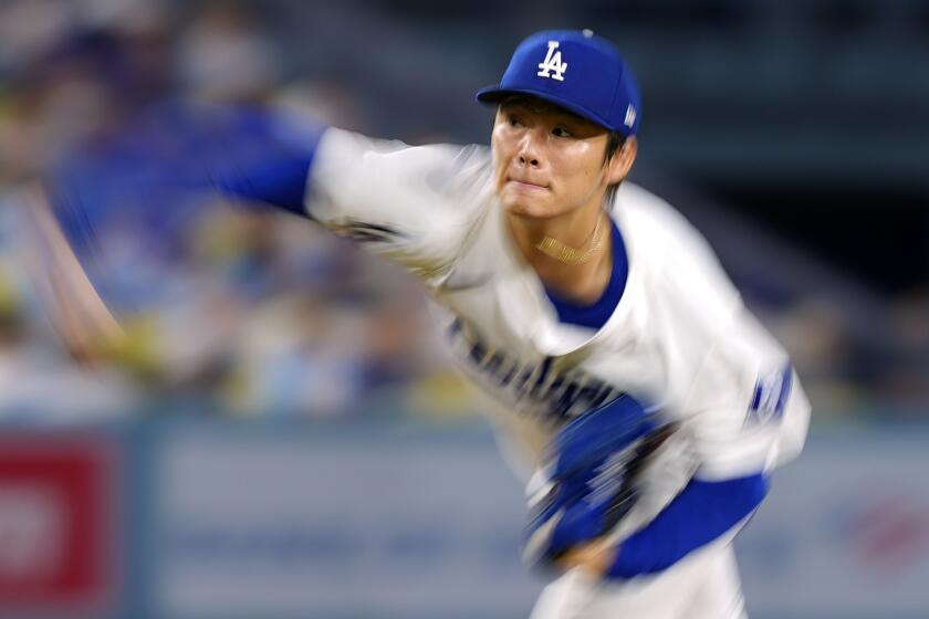 Los Angeles Dodgers starting pitcher Yoshinobu Yamamoto throws to the plate during the first inning of a baseball game against the Chicago Cubs, Tuesday, Sept. 10, 2024, in Los Angeles. (AP Photo/Mark J. Terrill)