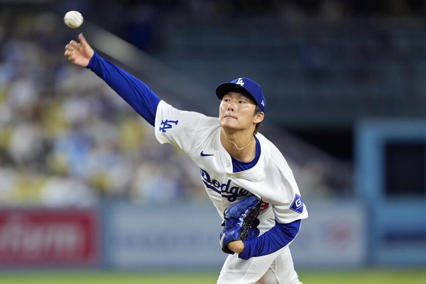 Los Angeles Dodgers starting pitcher Yoshinobu Yamamoto throws to the plate during the first inning of a baseball game against the Chicago Cubs, Tuesday, Sept. 10, 2024, in Los Angeles. (AP Photo/Mark J. Terrill)