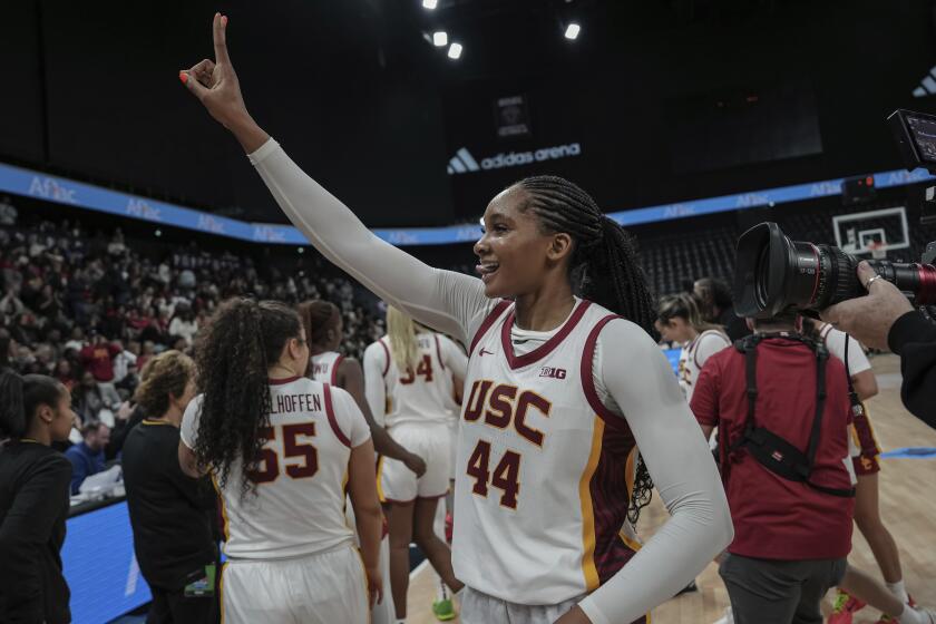 USC Trojans's forward Kiki Iriafen celebrates the victory during the basketball match.