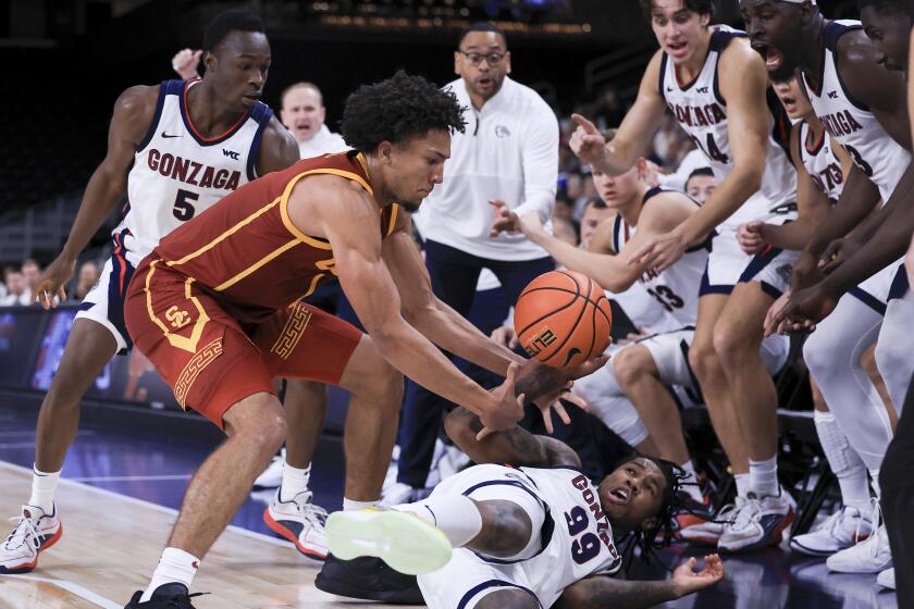 Gonzaga guard Khalif Battle, bottom right, vies for the ball against Southern California.