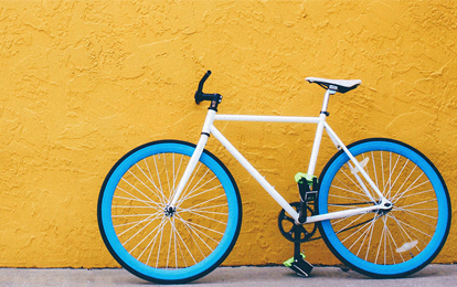 Bicycle leaning against wall