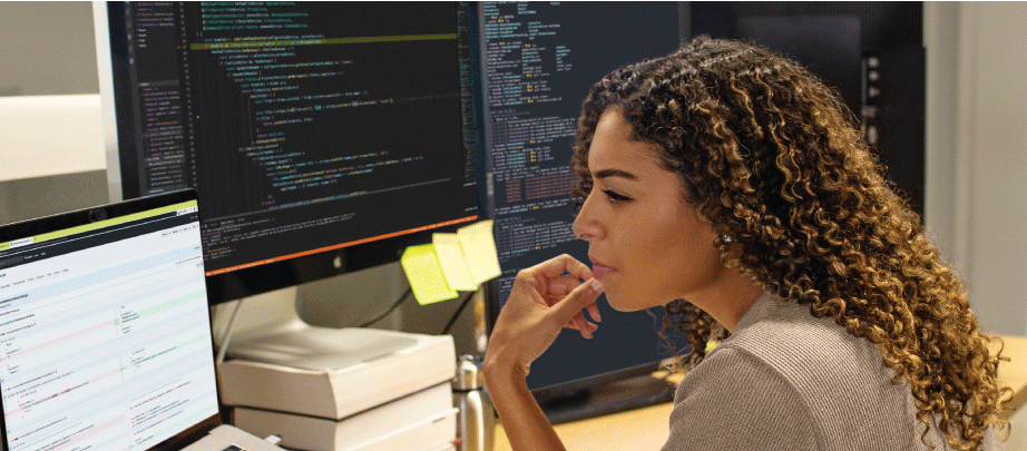 photo of employee viewing multiple screens