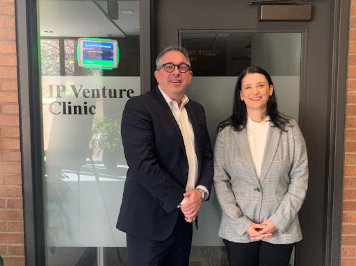 Two members standing in front of IP Venture Clinic door