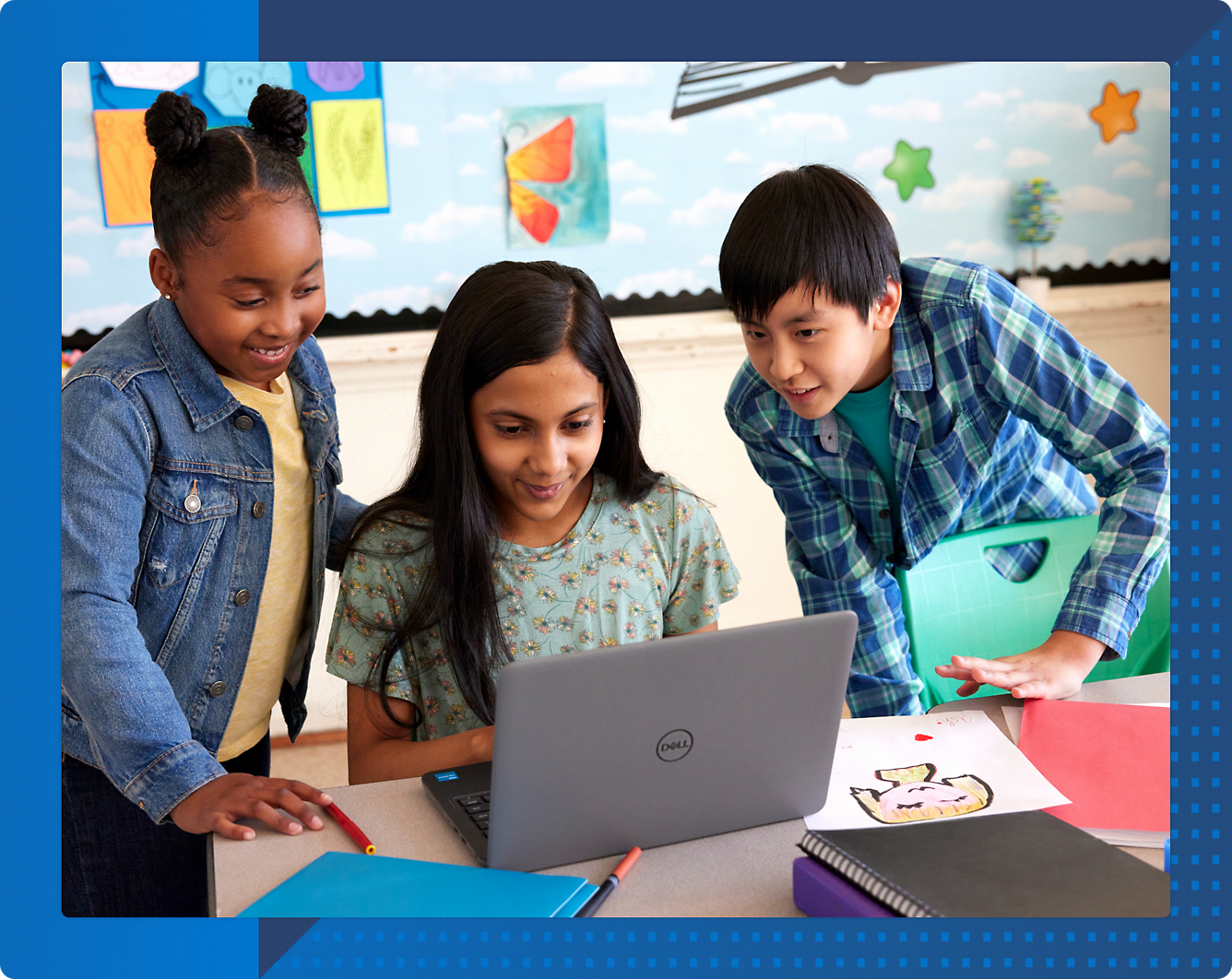 A group of children looking at a computer