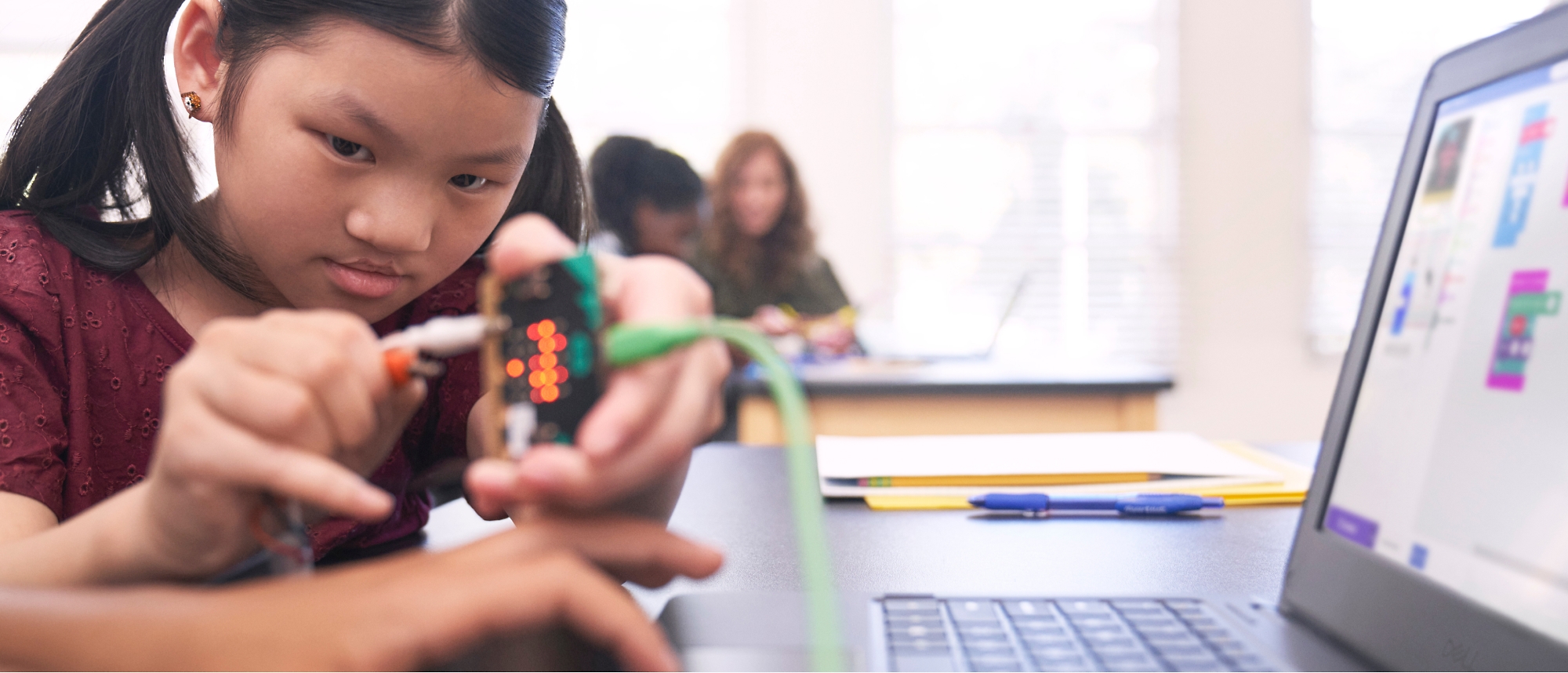 A child using a device to connect to a computer