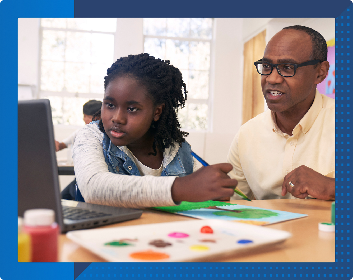 A person and a child working on a computer