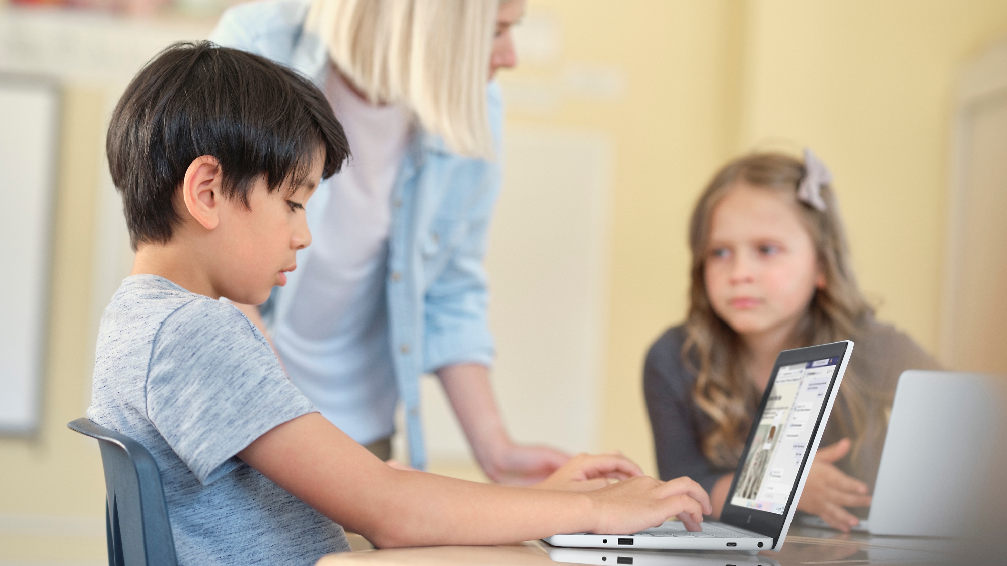 A group of children using a computer