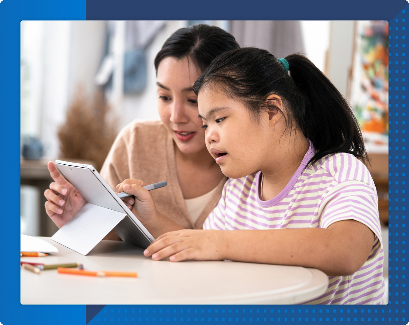 A person and a child looking at a tablet