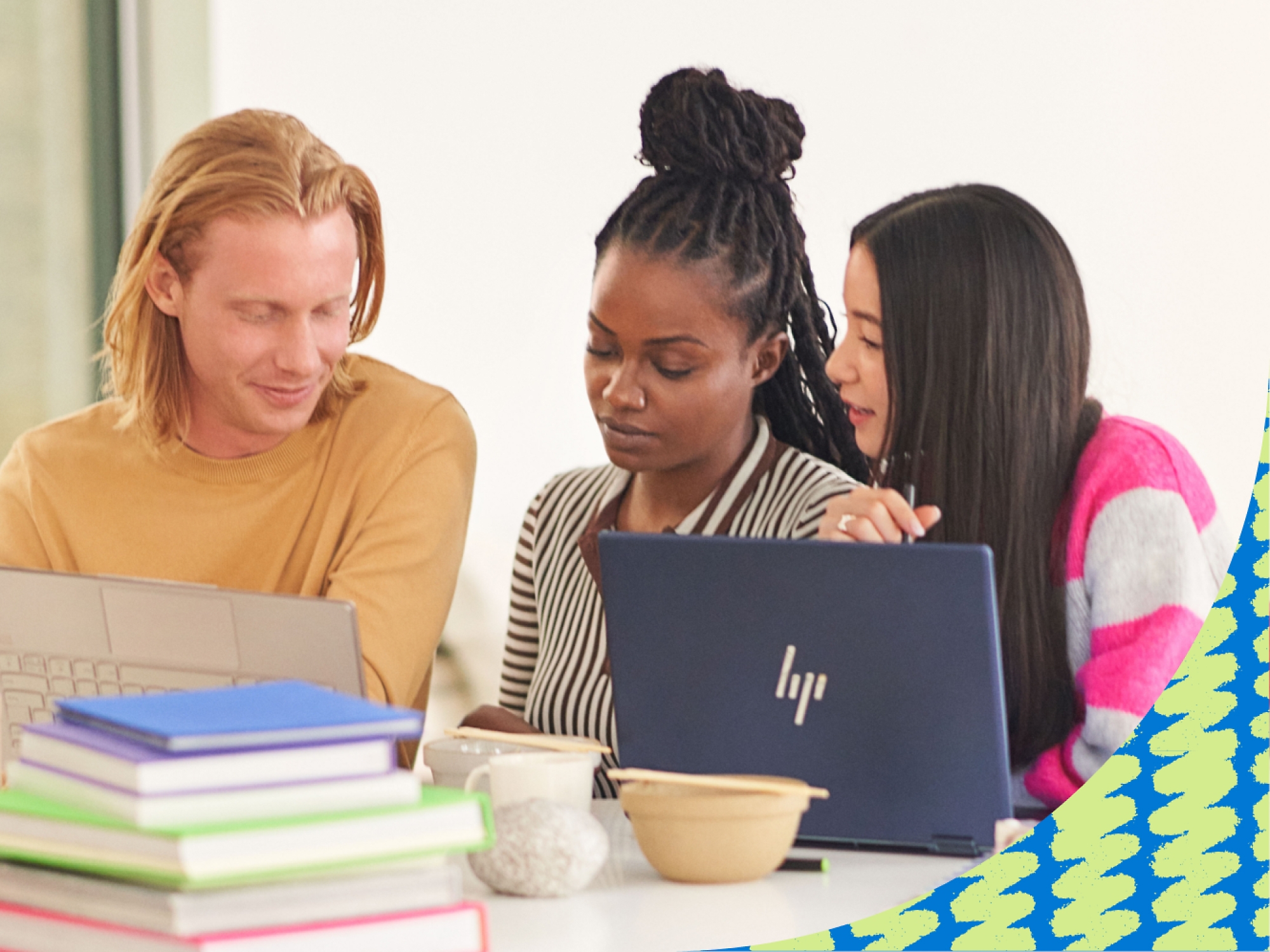 A group of people looking at a computer